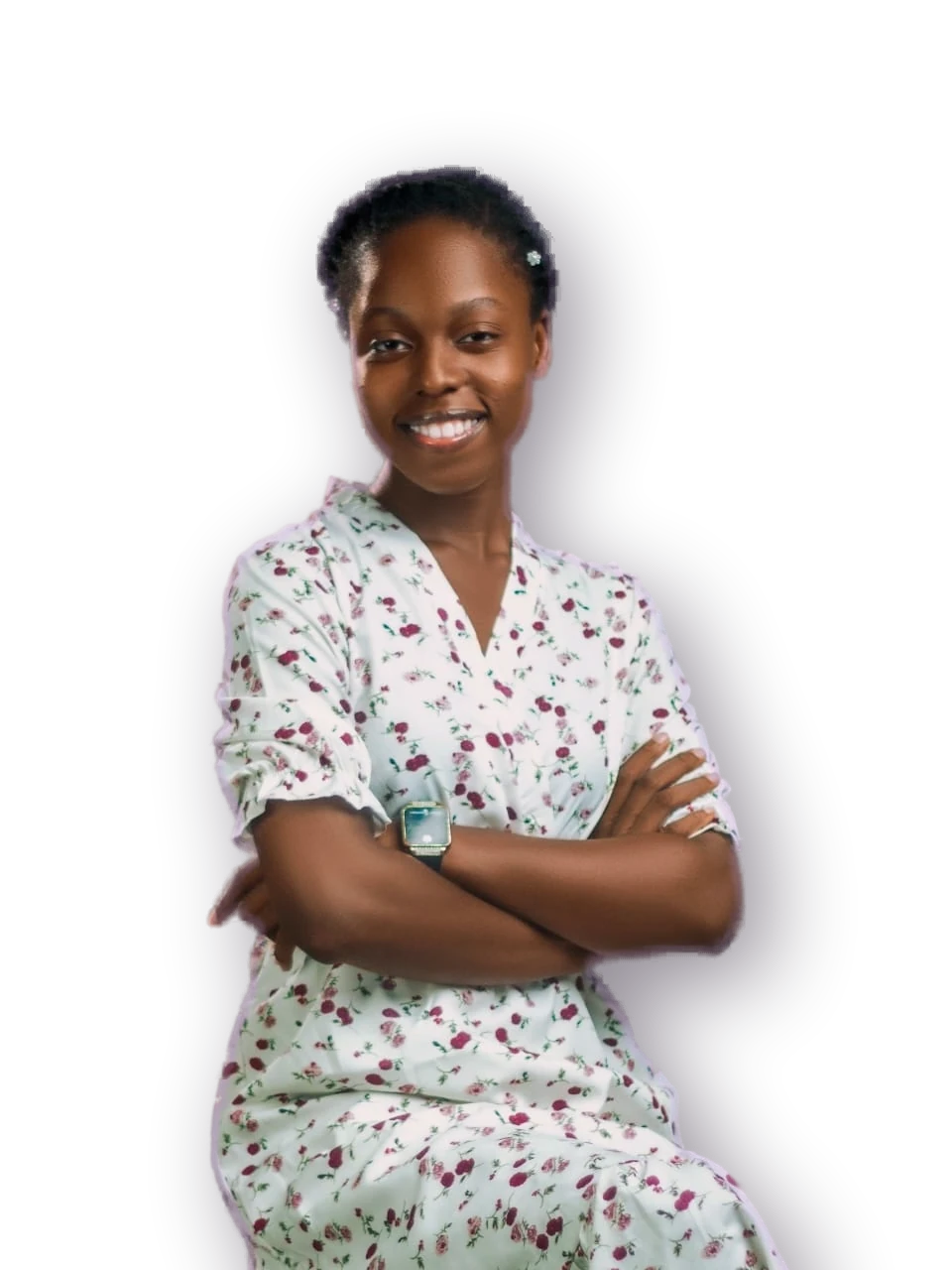 Smiling woman in a floral dress, arms folded